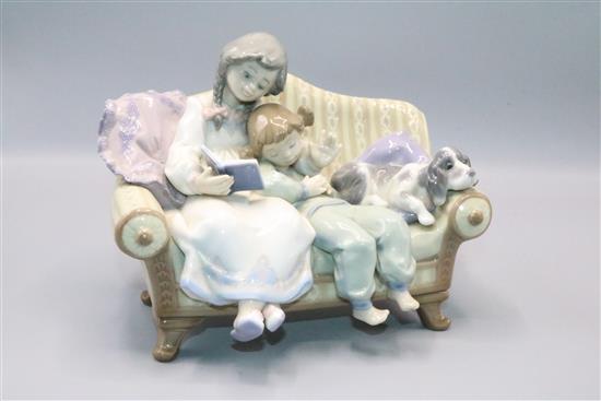 Lladro children & dog on sofa reading